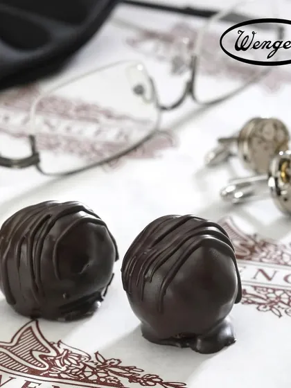 A treat for Father's Day. Two of our classic dark chocolate truffles, a simple, elegant, and delicious way to show appreciation.