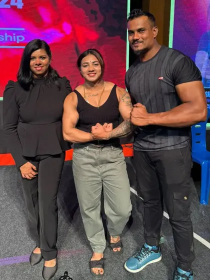A favorite photo from a recent event, standing with fellow fitness enthusiasts. The sense of community is one of the best parts of this industry.