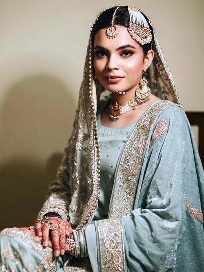 Doesn't she look like a true Shehzaadi? For this Nikah ceremony, I created a regal and elegant look with soft, defined eyes and a matte lip, letting her natural beauty and exquisite outfit shine.