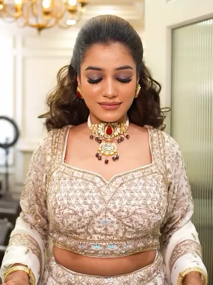 A close-up of the reception makeup with eyes closed, showing the beautiful blend of dark eyeshadows. This highlights the technical skill involved in creating a seamless smokey eye.