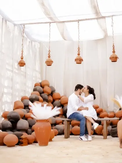 A wider view of the rustic, romantic set. This shot shows the full ambiance of the location, giving context to the couple's intimate moment.