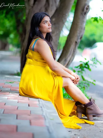 A moment of quiet reflection during our automotive-themed shoot. The contrast of the soft, flowing dress with the hard lines of the car creates a compelling visual.