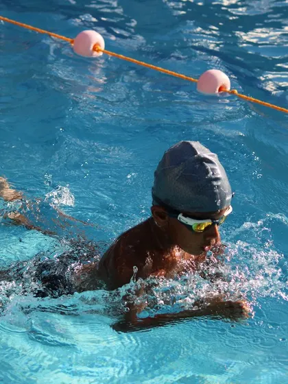 A young swimmer working on their breaststroke kick and glide.