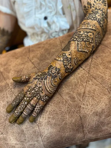 This is a detailed view of my intricate bridal henna work. Each design is unique, combining traditional patterns like paisleys and mandalas with fine-line fillers to create a stunning, full-coverage look for your special day.
