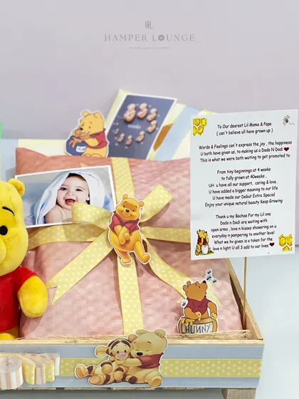 The heart of the Pooh-themed hamper is the personal note from the family. I believe words are just as important as the gifts, and I love incorporating these messages to express the joy and anticipation of the new arrival.
