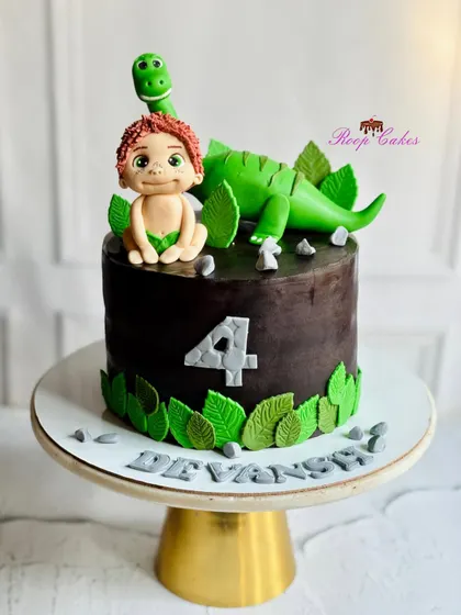 Where tiny explorers and gentle dinos bring birthday magic to life. This cake features a friendly dinosaur and a little boy, all handcrafted from fondant.