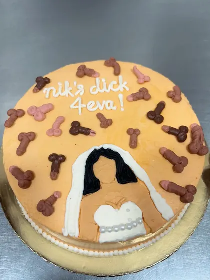 This bachelorette cake definitely brought some laughs to the bakery. Featuring a bride-to-be and a shower of edible decorations, it's a perfect example of the fun, custom, and naughty cakes I love to make for your special celebrations.