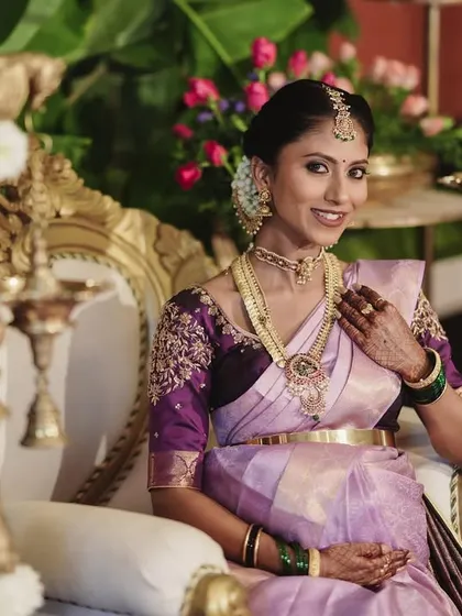 A regal shot of the mom-to-be at her seemantha (baby shower). The makeup is glowing and elegant.
