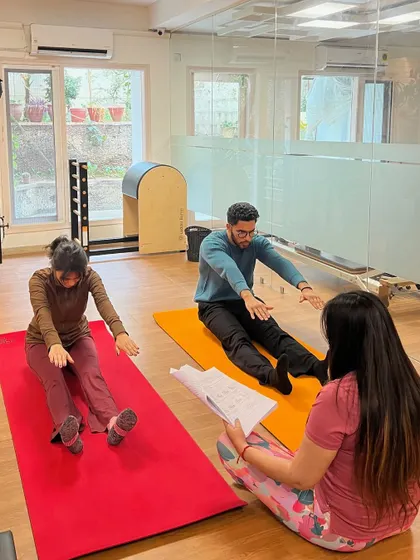Peer-to-peer practice is a big part of building teaching confidence. Here, one of my trainees guides her peers through a foundational mat exercise, learning to cue and correct in a supportive setting.