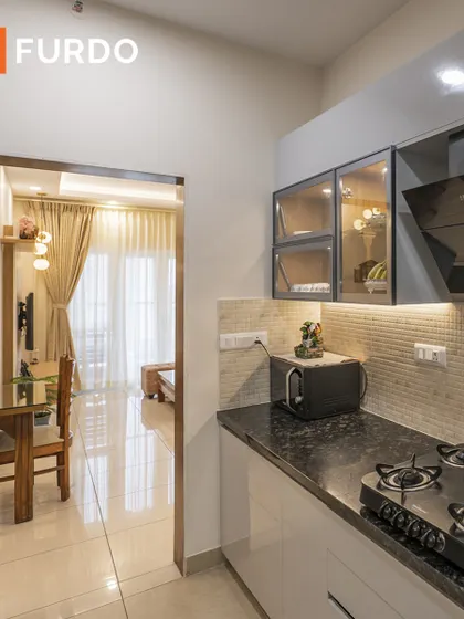 This view from the kitchen looks out into the dining and living areas, highlighting the open-concept layout. The design ensures the cook is always part of the conversation.