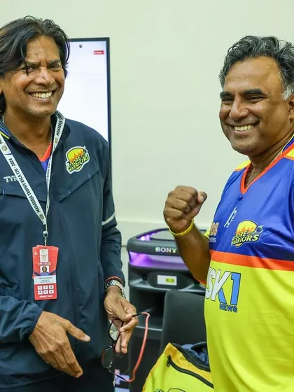 Sharing a laugh with a fellow coach. A positive and collaborative environment among the support staff translates to the players.
