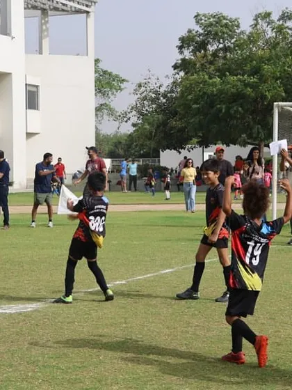 A player celebrates after scoring a goal in a league match.