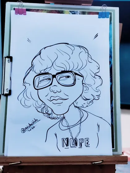 A cool, stylistic caricature with a fun "Nope" t-shirt. I love adding these little details that say something about the person.