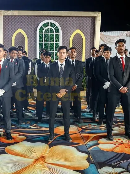 Our team of male servers in sharp black suits with red ties, presenting a modern and professional look for corporate events and formal functions.