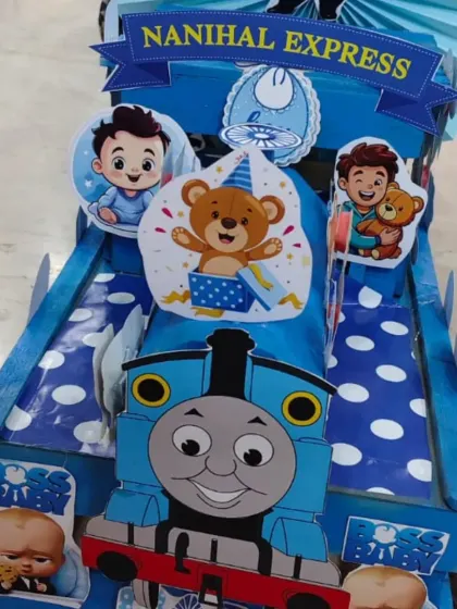 A close-up of the 'Nanihal Express' engine, featuring Thomas the Tank Engine and Boss Baby cutouts. I customize these themes based on what the client wants.