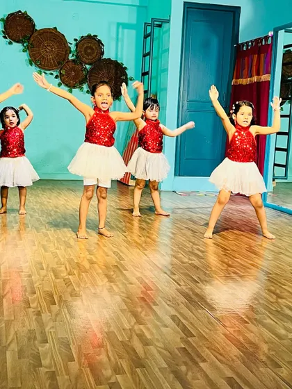 A group of our beginners performing a routine with synchronized arm movements.