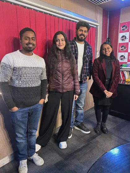 A group photo with the team at the Fever FM 104 radio station after an interview. Promoting original music is a key part of an independent artist's life, and I share these industry insights with my students.