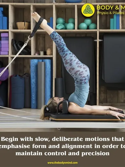 This image demonstrates an advanced inversion on the Reformer. Such movements are built up over time, starting with foundational exercises that emphasize control, precision, and deep core engagement.