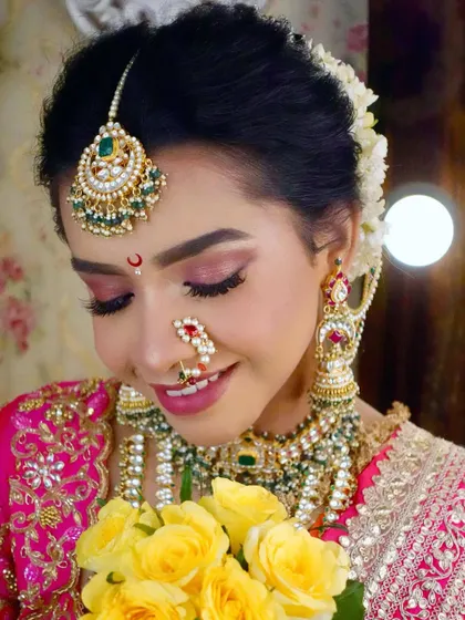 Capturing the radiant smile of our model. I teach my students how to create a glowing base that looks beautiful both in person and in photographs.