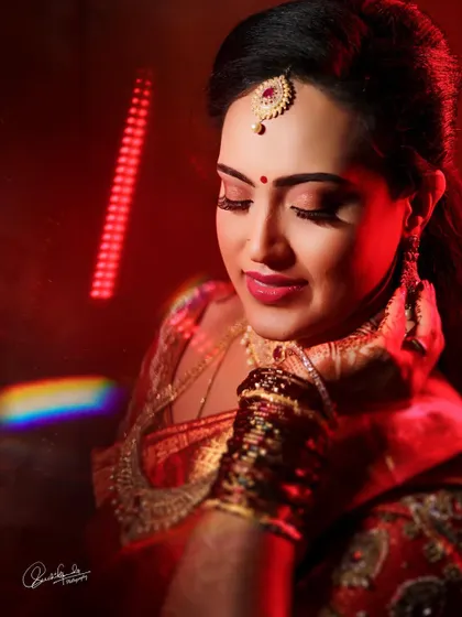 A moment of quiet reflection. The soft, blended eyeshadow and flawless base are the highlights of this stunning reception look.