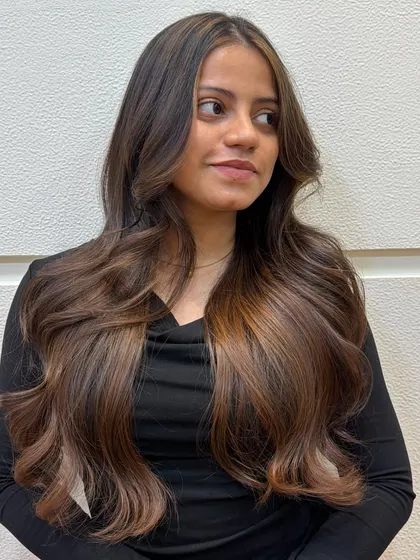 A stunning result for this bride-to-be's warm caramel brown hair. The color adds incredible richness and shine.