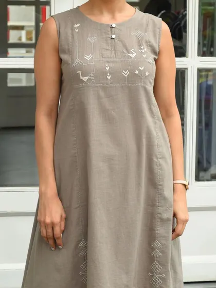 The Bagh sleeveless kurta can be worn as a dress or paired with palazzos. Its simple, elegant design and hand-embroidered details make it a versatile addition to any wardrobe.