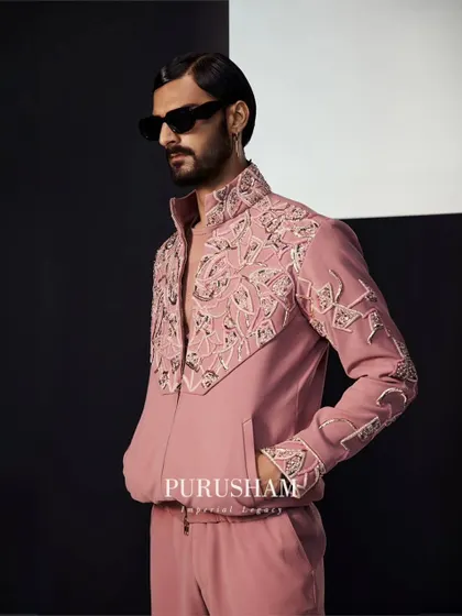 The palette for my Summer '24 collection is inspired by sun-kissed glows and tranquil ocean blues. This embroidered bomber set in dusty rose perfectly captures that seasonal essence.