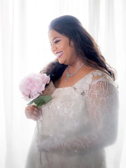 A dreamy, high-key portrait of the bride, looking angelic in her white gown.