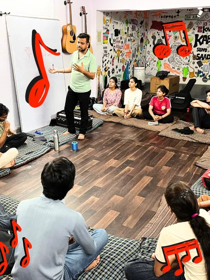 An instructor uses a whiteboard to teach 'Alankars' in Hindustani Classical Vocals. We combine traditional teaching methods with visual aids to make complex concepts easier to understand.