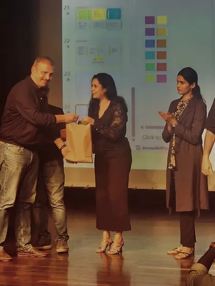 A moment of recognition on stage at the Designuru event.