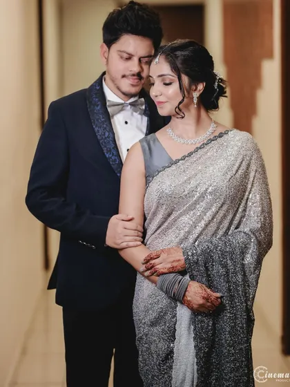 An elegant portrait of the couple after their engagement, showcasing their coordinated outfits and the quiet joy of the moment.