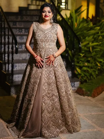 A full-length shot of the bride in her stunning sangeet gown. The hair and makeup complete the look, making her look like a star.