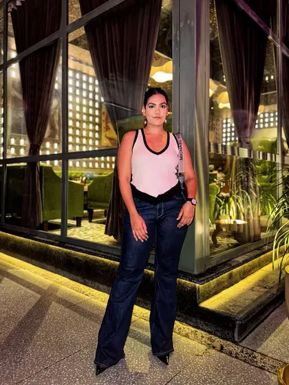 Another take on the white tank and flared jeans combo. This look is timeless, chic, and always a good idea.