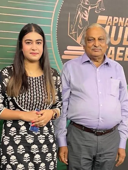 With a fellow panelist on the DD Urdu show. Engaging with other experts helps create a richer and more comprehensive discussion for the audience.