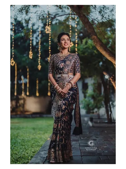 Prathima looking elegant for her Pellikuthuru function. The makeup is soft and natural, with a focus on glowing skin that looks beautiful in the outdoor evening light.