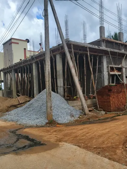 A worker on site at the Hosadurga project, overseeing the progress of the structural work.