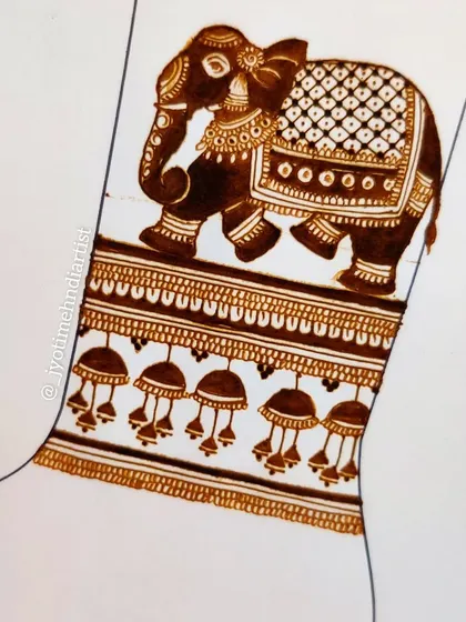 A sketch of a bridal startup pattern for the arm, featuring an elephant and hanging jhumkas.