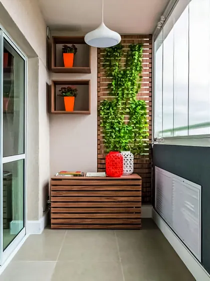 This enclosed balcony focuses on minimalism and utility. A wooden storage bench provides seating and a place to store items, while a small vertical garden adds a touch of green without clutter.