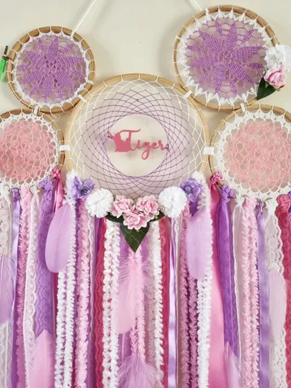A close-up of the custom cat dreamcatcher, showing the 'Tiger' name cutout and the delicate floral arrangement that makes this piece so special.