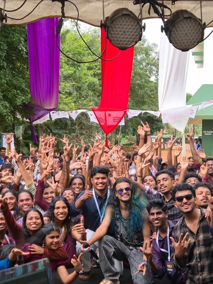 Another great group photo with the students, all of us making hand signs for the camera after an amazing show.