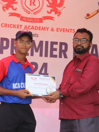 A player from the RCA Capitals receives his participation certificate. Every player who competes is a part of our journey.