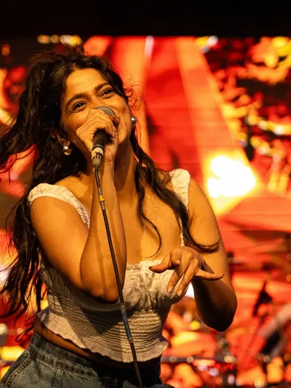 Lost in the music during a high-energy song. The dynamic stage lighting and background visuals added so much to the performance at the Terai Bazaar festival.