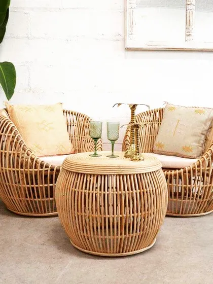 Our "Peacock" style rattan lounge set, with its distinctive rounded shape and intricate weave, creates an inviting and stylish seating area. The set includes two comfortable armchairs and a matching coffee table, perfect for cafes, lobbies, or a chic living room.