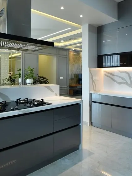 A duplicate of 217, this photo captures the finished kitchen from a different perspective, highlighting the under-cabinet lighting and the reflective quality of the high-gloss surfaces.