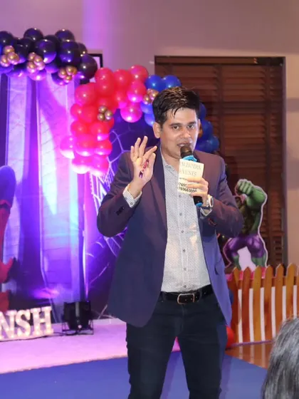 A shot of me hosting a Spiderman-themed birthday party, explaining a game to the audience.