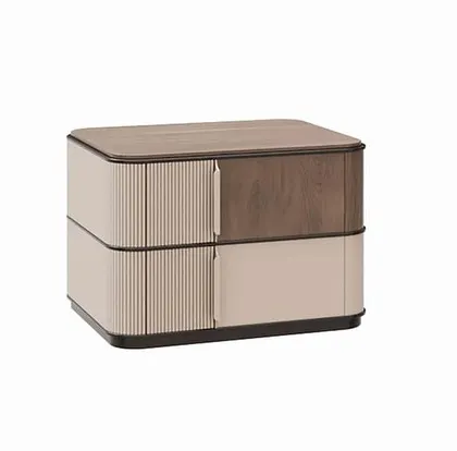 A studio shot of the two-tone bedside table, showing the contrast between the reeded drawer front, the smooth painted drawer, and the rich wood veneer top.