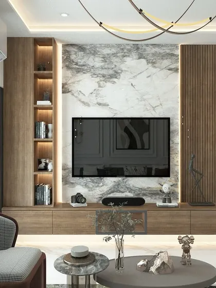A close-up of a TV unit that combines a rich wood finish with a luxurious marble back panel. The vertical fluted panel and backlit display shelves add texture and warmth, making the TV wall a stunning focal point.