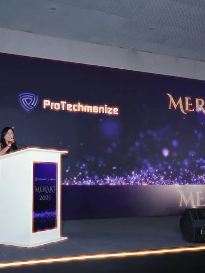 At the podium during Meraki 2025. I ensure a commanding stage presence for corporate annual day events and celebrations.