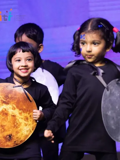 Children dressed as planets and stars perform for our "Pancha Tattva" Annual Day. This dance represents Aakash (Space), the vast expanse that holds the universe.