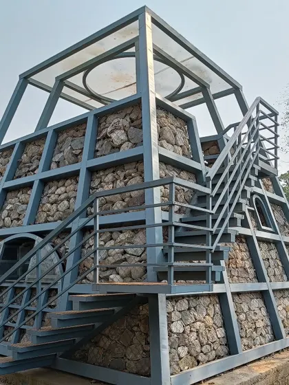 **WIP, Jawai/Nashik:** A stone-filled gabion structure under construction. This is part of our exploration of using local materials and forms in diverse landscapes, from the rocky wilds of Jawai to the fields of Nashik.